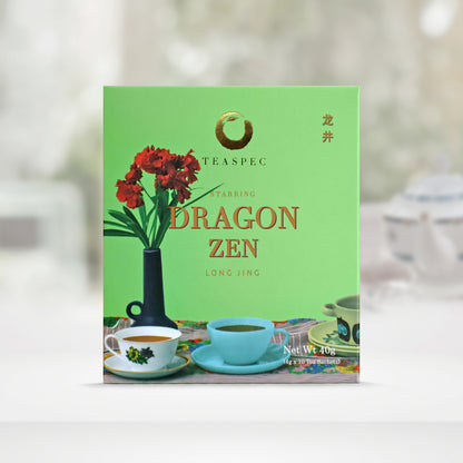 TEASPEC Dragon Zen Long Jing Chinese Loose Leaf Green Tea box with a net weight of 40g, comes in 4g Sachets x 10 per box. The front of the box design is a soft green color with a table that has a black vase with red flowers and some porcelain teacups on it. The Chinese name of the tea is 龙井