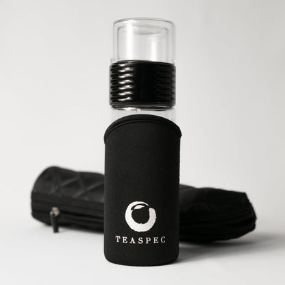 Black glass lazy go glass travel tumbler with black sleeve and TEASPEC logo on a white background